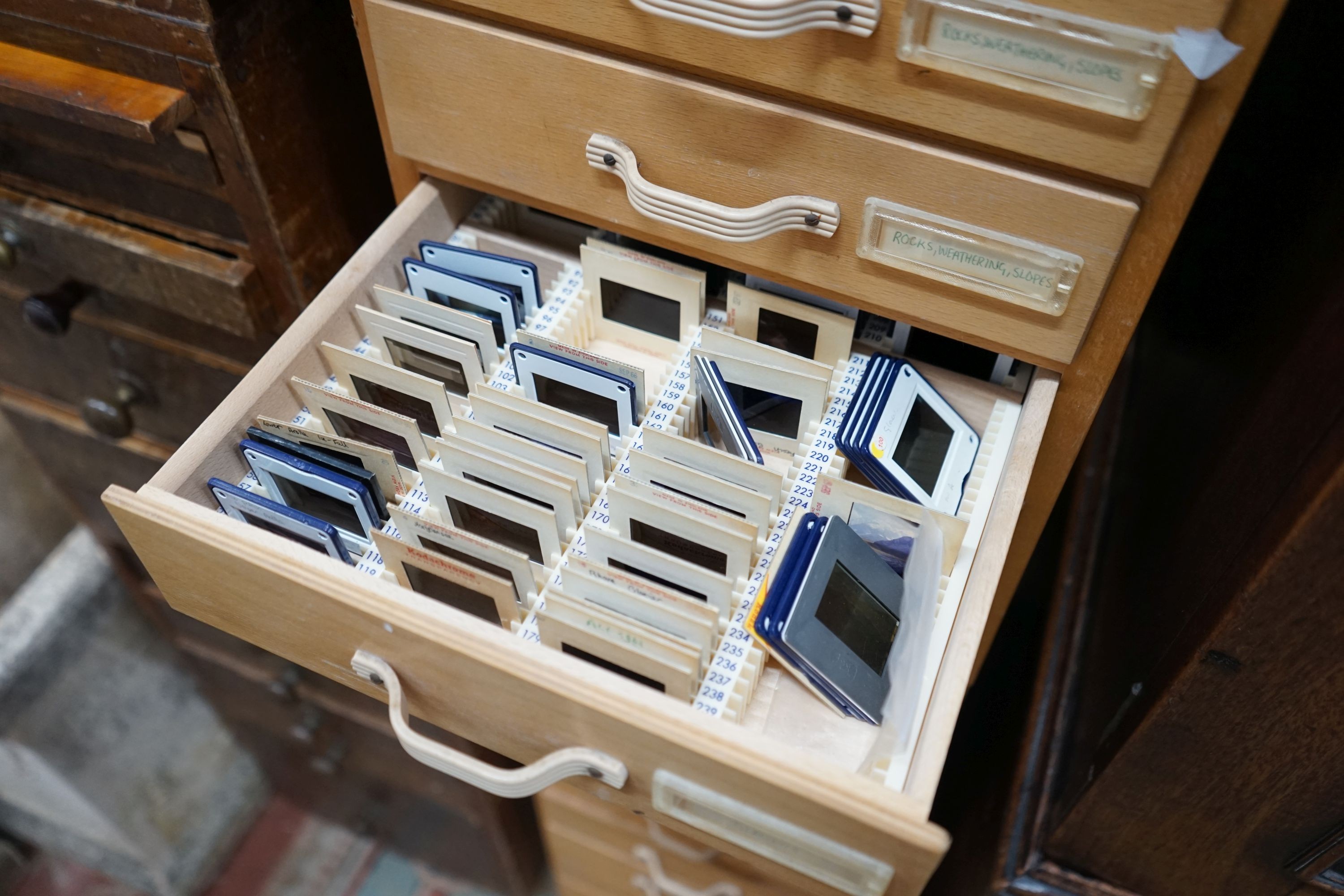 A set of four mid century five drawer photographic slide chests, width 29cm, depth 38cm, height 39cm